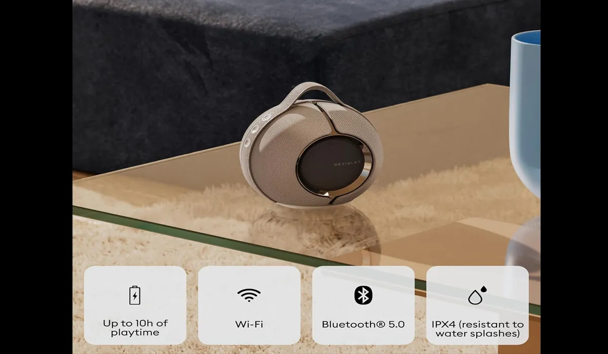 Portable premium speaker used in a modern workspace for music and ambience