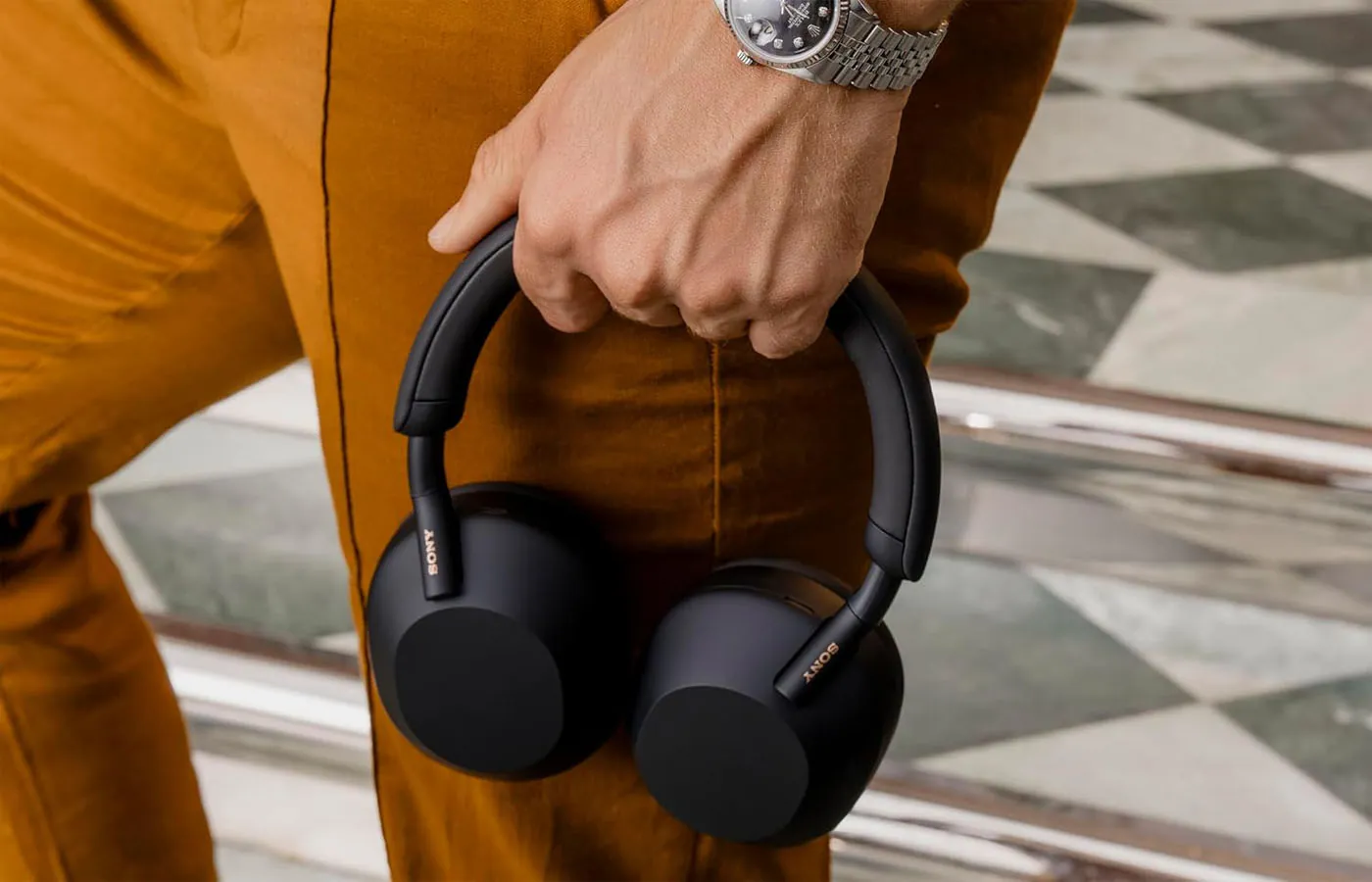 Noise canceling headphones used during travel representing airplane and commuting use-cases