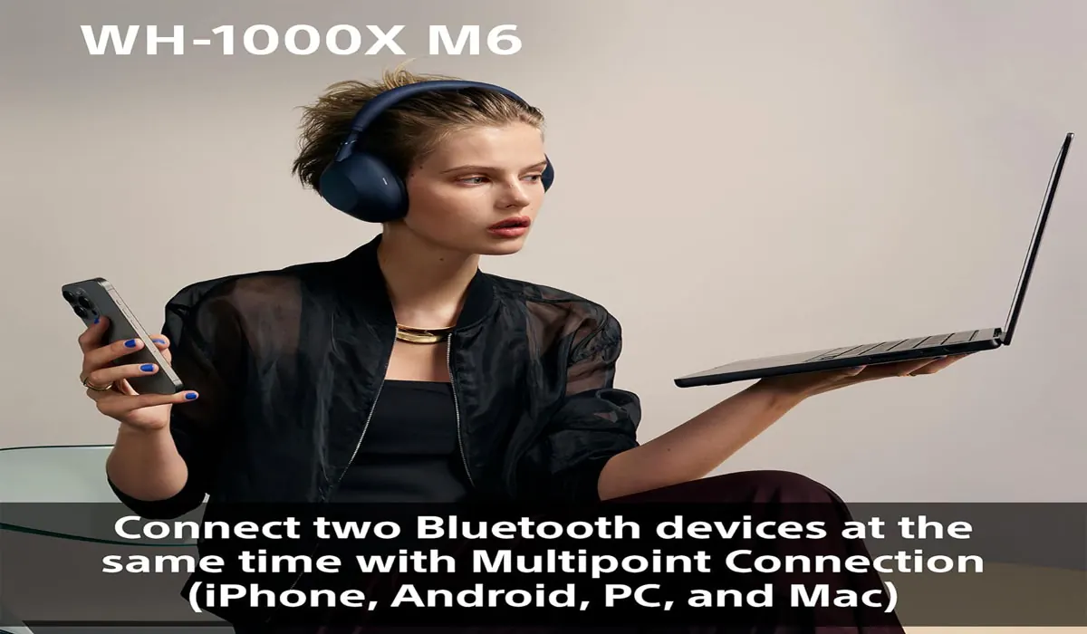 Person using over-ear noise cancelling headphones while working in a bright coffee shop