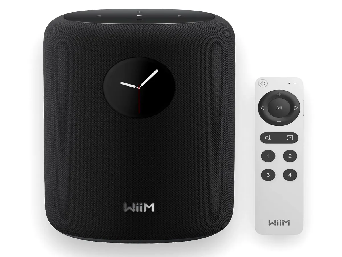 WiiM Sound smart speaker in a modern living room setup with touch display visible